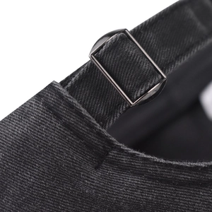 Detail of adjustable metal buckle on washed cotton twill black baseball cap