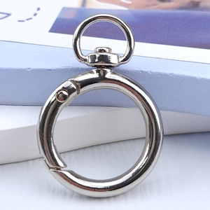 Close-up of a silver zinc alloy spring O-ring with a swivel clip for keychains and bags