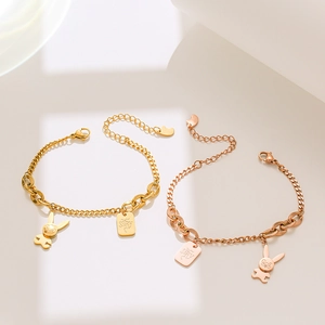 Rose gold rabbit pendant bracelet with square charm on minimalist white background