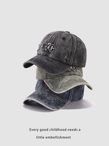 Vertical stack of washed denim baseball caps in charcoal, olive green, and navy with DYC embroidery