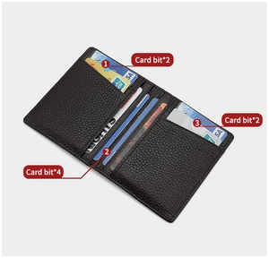 Detail of slim black leather card holder showing 8 interior slots and pebbled texture
