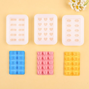 Silicone heart and pill shaped mold for DIY chocolate and resin crafts on yellow surface