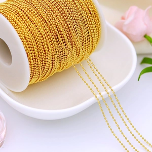 Macro shot of 18K gold plated copper ball bead chain spool for DIY jewelry making