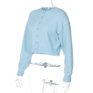 Close-up of light blue knit cardigan featuring single-breasted buttons and ribbed cuffs