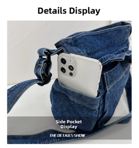 Detail view of side pocket on blue denim kids shoulder bag with smartphone for size reference