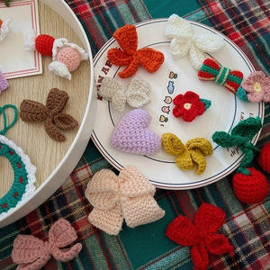 Handmade crochet Christmas tree ornaments and assorted colorful knitting DIY accessories