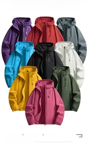 Flat lay showing various colors of lightweight hooded windbreaker jackets with zip pockets