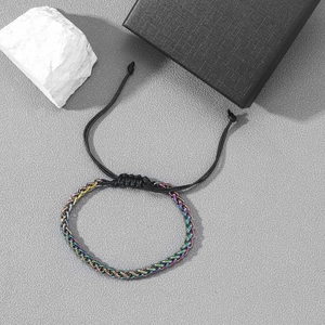 Detail of colorful plated dragon bone chain with adjustable black braided rope closure