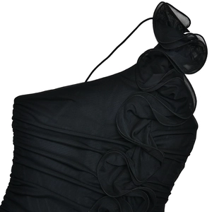 Detail of black mesh one-shoulder dress with elegant ruching and 3D floral accent