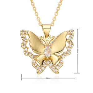 Detail view of gold butterfly pendant with size markings of 20mm height and 24mm width