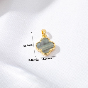 Detailed size view of 14K gold clover pendant with grey shell inlay and measurements