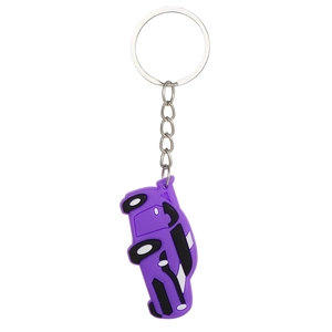 Detail view of a purple cartoon car keychain made of soft PVC with silver metal ring