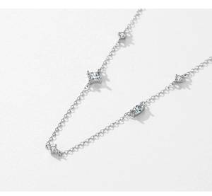 Macro detail of S925 silver necklace featuring square and marquise-cut cubic zirconia