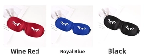 Detailed view of 3D contoured sleep masks in wine red, royal blue, and black with eyelash print