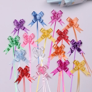 Close-up of colorful PP plastic pull bows with embossed heart and rose textures