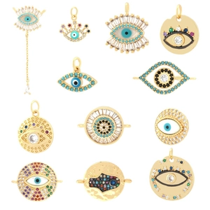 Collection of 11 assorted gold-plated Evil Eye shell pendants with colorful zircon stones