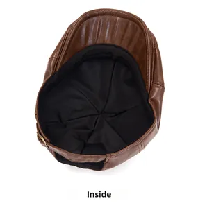Inside view of brown faux leather beret featuring black lining and sweatband detail