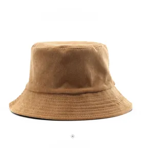 Detailed macro view of the brown corduroy fabric texture and stitching on the bucket hat