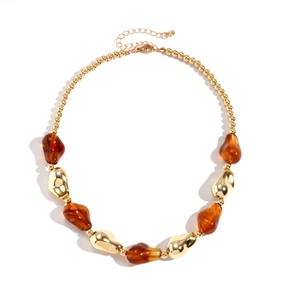 Bohemian irregular amber resin and gold bead necklace with geometric chunky design
