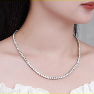 Macro detail of the 925 silver tennis necklace featuring a full row of Moissanite stones