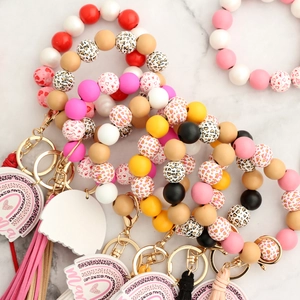 Silicone bead keychain bracelet with leopard print heart charm and Mama rainbow tag