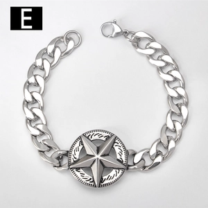 Macro view of stainless steel Cuban link bracelet with engraved star charm and lobster clasp