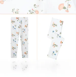 Detailed close-up of girls floral print cotton leggings featuring cute rabbit patterns