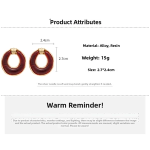 Detailed view of burgundy resin hoop earrings with alloy gold finish and dimensions