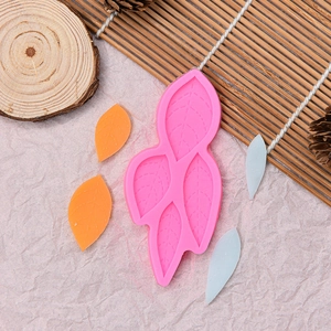 Pink silicone mold with 4 leaf patterns for chocolate, cake and fondant baking
