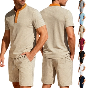 Close-up of geometric textured fabric on men's summer two-piece set with contrast collar