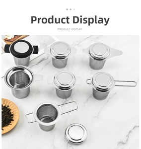 Detailed collection of 304 stainless steel tea infusers with silicone lids on marble