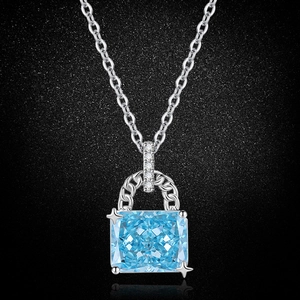 Detail of square sea blue gemstone pendant with small diamonds on silver chain
