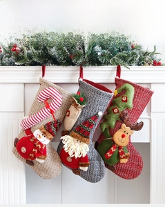 Close-up of 50cm large knitted Christmas stocking featuring 3D Santa and reindeer decor
