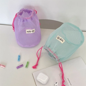 Portable mesh drawstring storage bag in purple and blue for travel toiletries