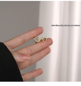 Detail showing the opening mechanism of S925 sterling silver heart-shaped hoop earrings