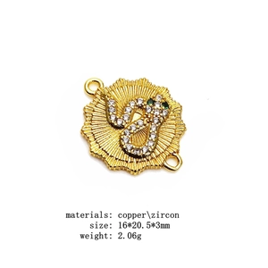 Macro view of gold snake connector with micro zircon and sunburst base for DIY jewelry