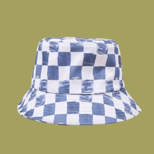 Detailed view of the blue and white checkerboard tie-dye pattern on the bucket hat