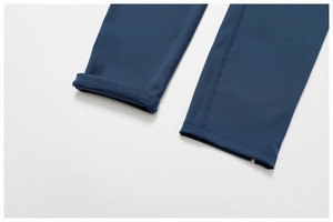 Detail of navy blue yoga pants showing high-elastic fabric and flatlock stitching