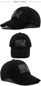 Close-up of black tactical cap showing laser perforated panels and US flag PVC patch