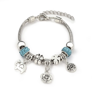 Silver alloy charm bracelet with blue rhinestones and diverse nature-inspired pendants