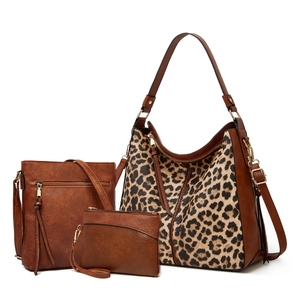 Three-piece women's handbag set featuring leopard print tote, crossbody bag, and clutch