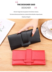 Lifestyle shot of black and red lychee grain leather wallets on a wooden surface