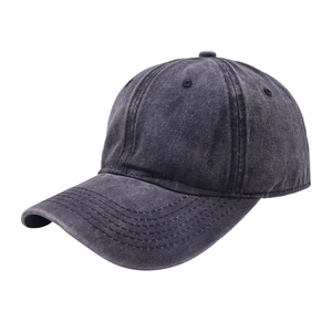 Detailed view of dark grey washed cotton baseball cap with multi-row stitched brim and air holes
