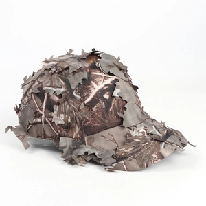 Macro detail of 3D laser-cut leaves on a woodland camouflage tactical baseball cap
