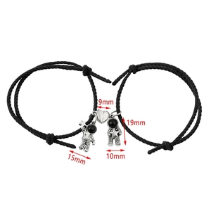 Detail view of magnetic astronaut bracelets with measurements 9mm and 19mm for couples