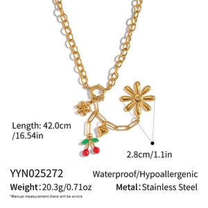 Detail view of 18K gold plated stainless steel necklace with cherry and floral charms