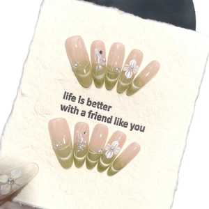Cat eye press-on nails with 3D floral relief, pearls, and crystals in a pink gradient