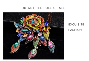 Macro view of vintage Baroque brooch with colorful rhinestones and floral details