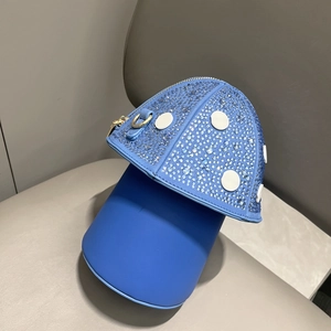 Detailed top view of a blue mushroom shaped handbag with sparkling rhinestones on PU leather