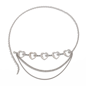 Detail of silver layered body chain with heart charms and sunburst engraved elements